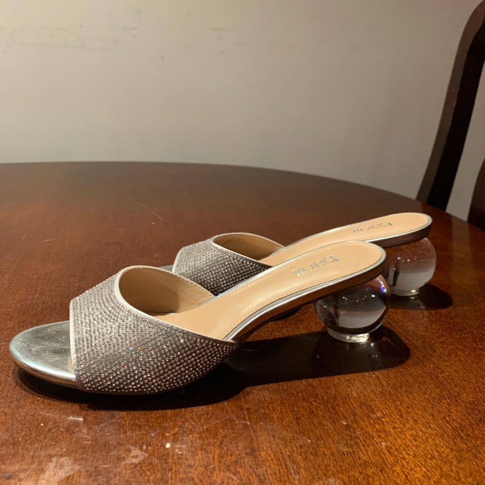 Glitter crystal sandals with clear bulb heels.